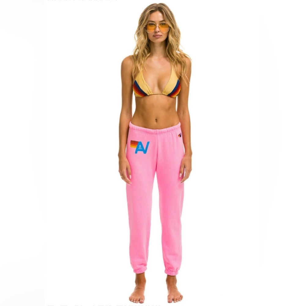 Aviator Nation sweatpants with 4 small white bleach stains.